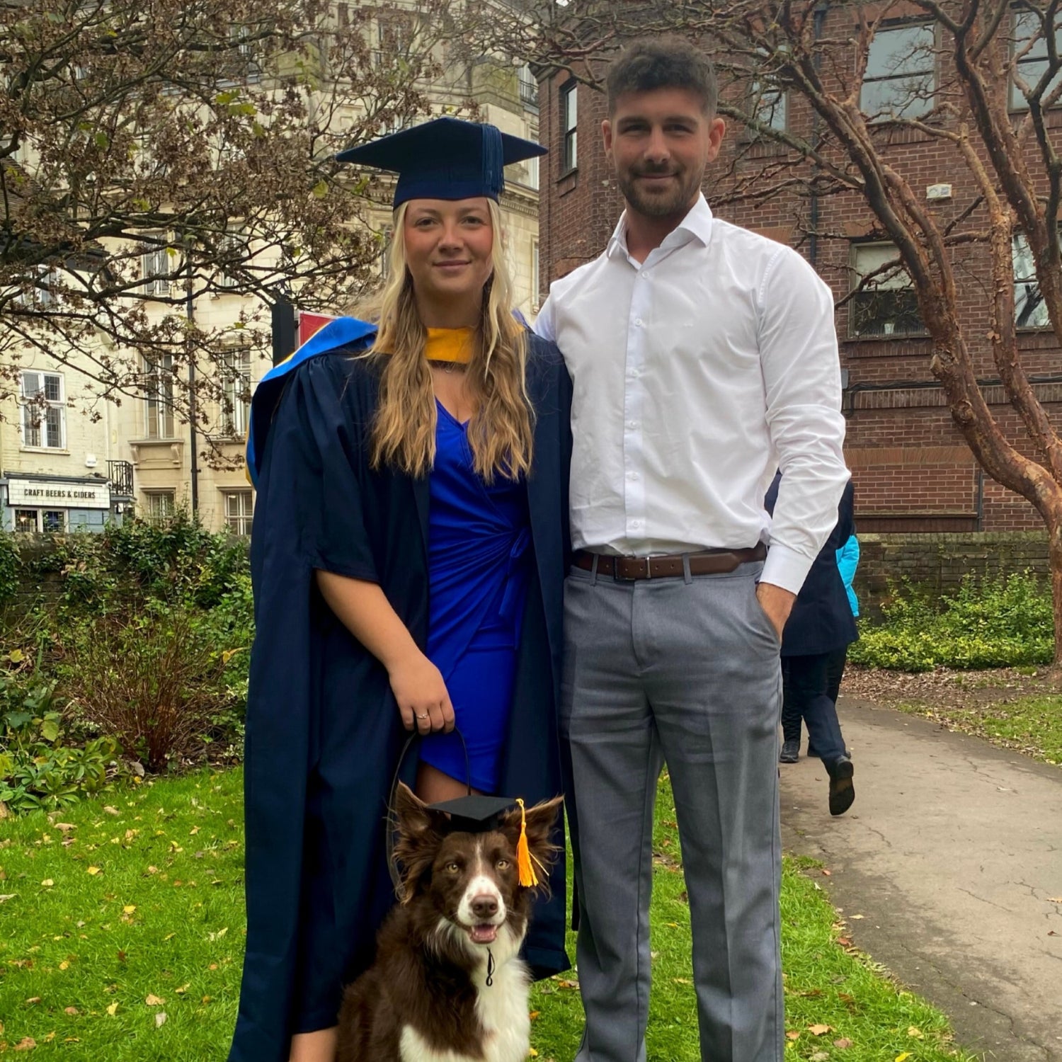 Man and Woman with dog at graduation