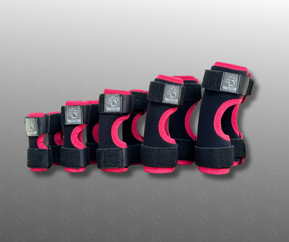Set of pink dog carpal wraps with brand logo on a gray background